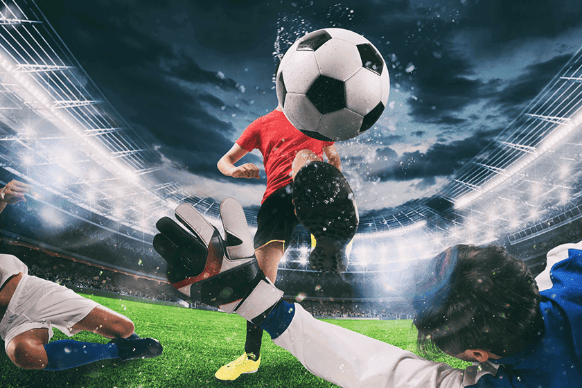 Soccer player kicking ball mid-air at a floodlit stadium – FIFA World Cup 2026 betting action shot