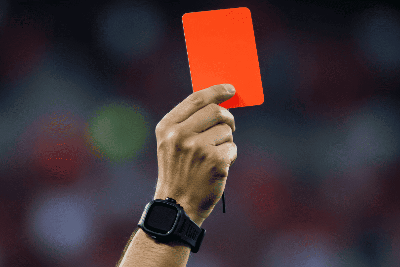 A referee showing a red card