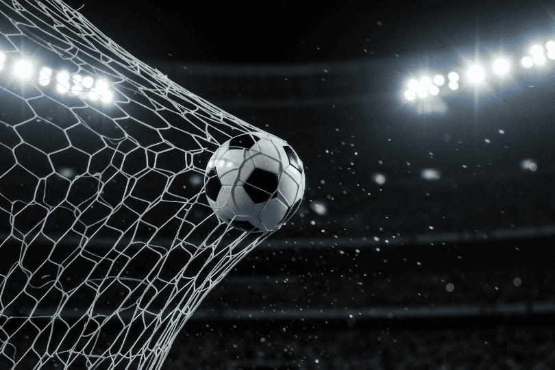 Football in the net in a stadium